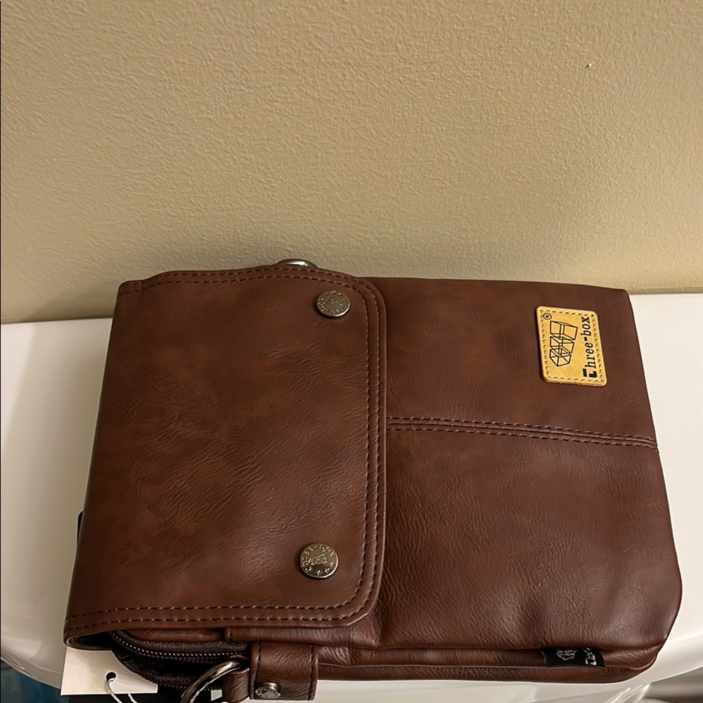 THREE BOX MALE CROSS BODY BAG WITH STRAP.  INSIDE POCKETS STYLISH.  NWT